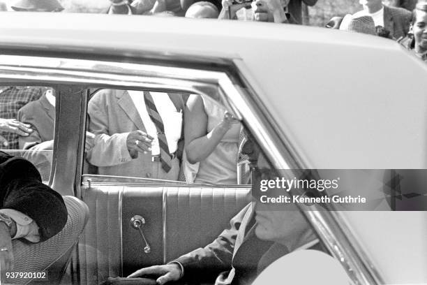 Partial view of Senator Robert F Kennedy inside a vehicle while attending the funeral of the Reverend Martin Luther King, Jr at Ebenezer Baptist...