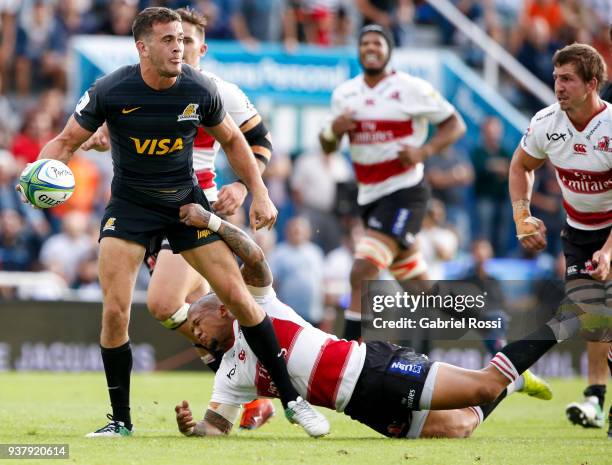 Emiliano Boffelli of Jaguares is tackled by Elton Jantjies of Lions during a match between Jaguares and Lions as part of the sixth round of Super...