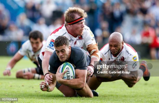 Emiliano Boffelli of Jaguares is tackled by Jacques Van Rooyen of Lions during a match between Jaguares and Lions as part of the sixth round of Super...