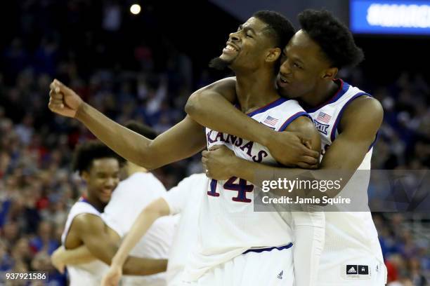 Malik Newman and Marcus Garrett of the Kansas Jayhawks celebrates against the Duke Blue Devils during overtime in the 2018 NCAA Men's Basketball...