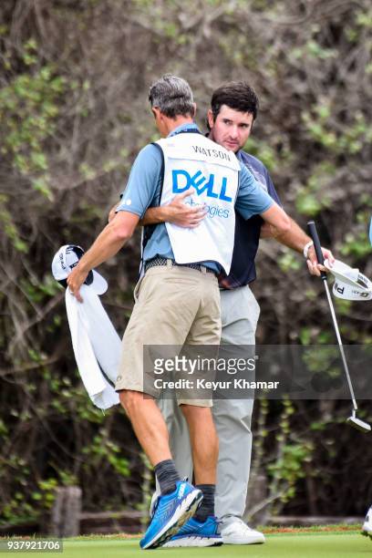 Bubba Watson celebrates his 7&6 victory and hugs his caddie Ted Scott on the 12th hole green following the championship match at the World Golf...