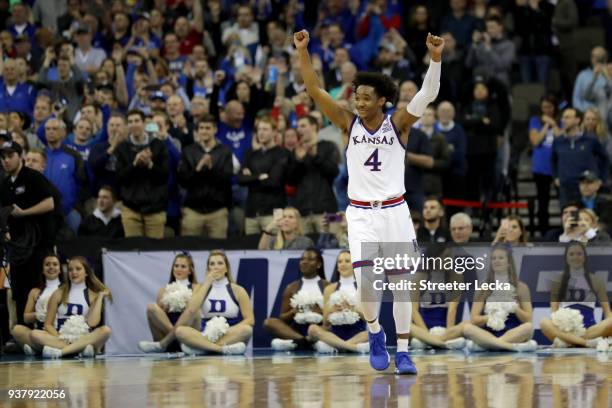 Devonte' Graham of the Kansas Jayhawks celebrates after defeating the Duke Blue Devils with a score of 81 to 85 in the 2018 NCAA Men's Basketball...