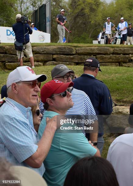 Fans watch Bubba Watson hitting a tee shot on the 12th hole during the championship match at the World Golf Championships-Dell Technologies Match...