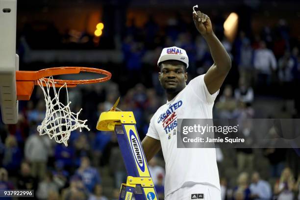 Udoka Azubuike of the Kansas Jayhawks celebrates cutting down the net after defeating the Duke Blue Devils with a score of 81 to 85 in the 2018 NCAA...