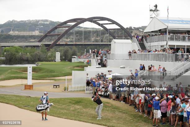 Bubba Watson of the United States plays his second shot on the 12th hole during his final round match against Kevin Kisner of the United States in...