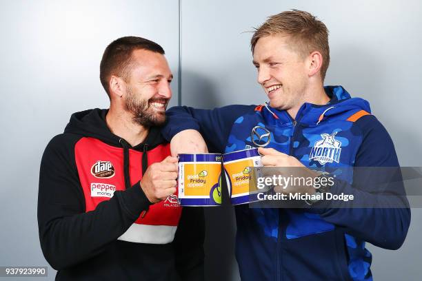 North Melbourne captain, Jack Ziebell and St Kilda captain, Jarryn Geary pose ahead of the Good Friday match on March 26, 2018 in Melbourne,...