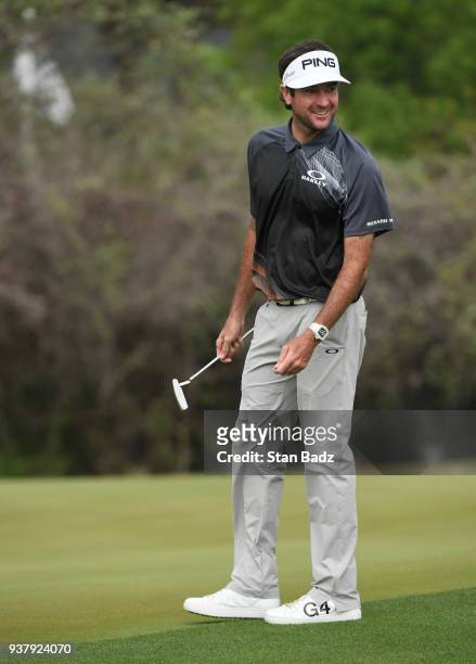 Bubba Watson smiles after hitting a chip shot on the 12th hole during the championship match at the World Golf Championships-Dell Technologies Match...