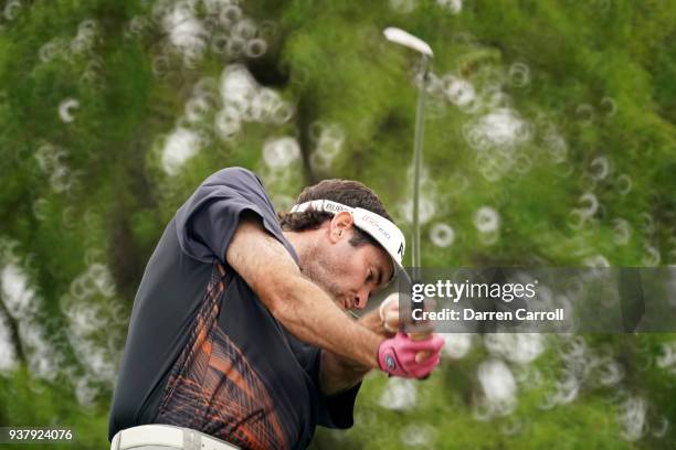 Bubba Watson of the United States plays his shot from the 11th tee during his final round match against Kevin Kisner of the United States in the...