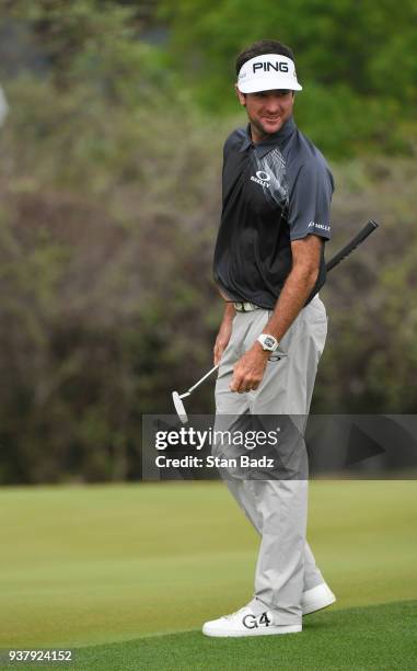 Bubba Watson smiles after hitting a chip shot on the 12th hole during the championship match at the World Golf Championships-Dell Technologies Match...