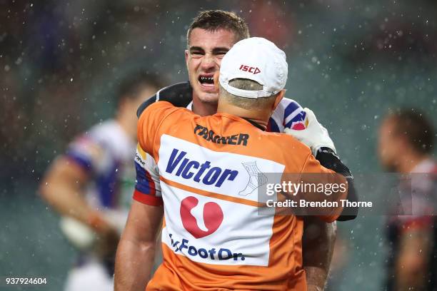 Connor Watson of the Knights receives treatment during the round three NRL match between the Sydney Roosters and the Newcastle Knights at Allianz...