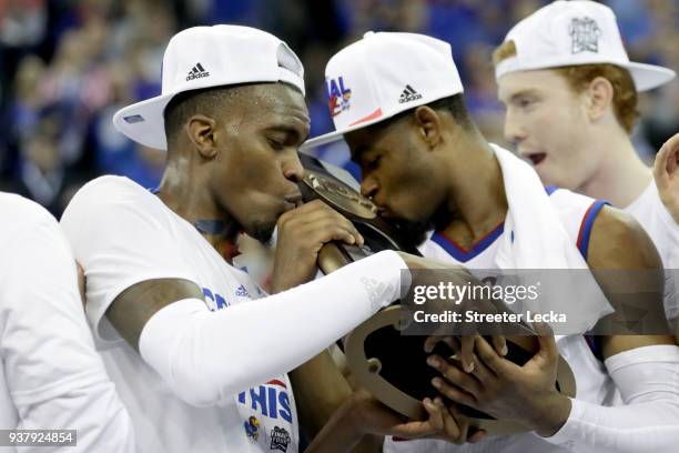 Lagerald Vick and Malik Newman of the Kansas Jayhawks kiss the tropy after defeating the Duke Blue Devils with a score or 81 to 85 in the 2018 NCAA...