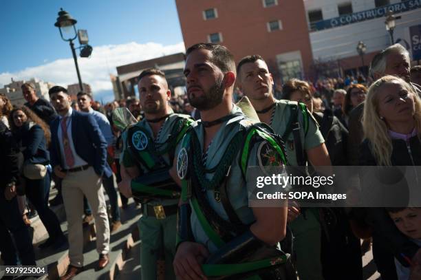 Spanish legionnaires listening a "saeta" song to the procession of "Huerto" brotherhood during the Holy Week in Malaga. The Holy Week in Andalusia is...