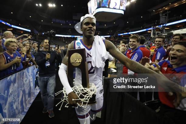 Lagerald Vick of the Kansas Jayhawks celebrates with the tropy after defeating the Duke Blue Devils with a score or 81 to 85 in the 2018 NCAA Men's...