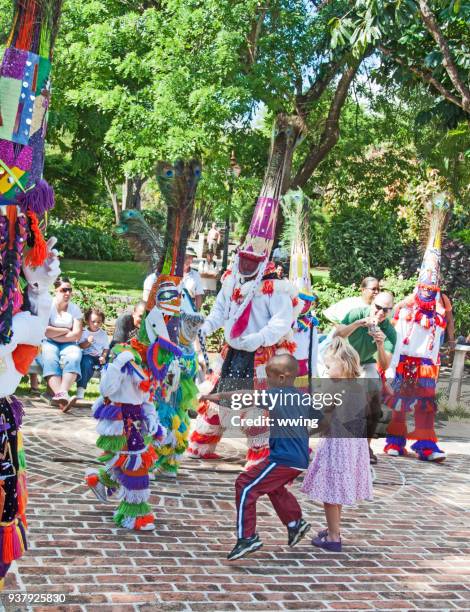 gombey dancers in public hamilton bermuda park - gombey dancer stock pictures, royalty-free photos & images