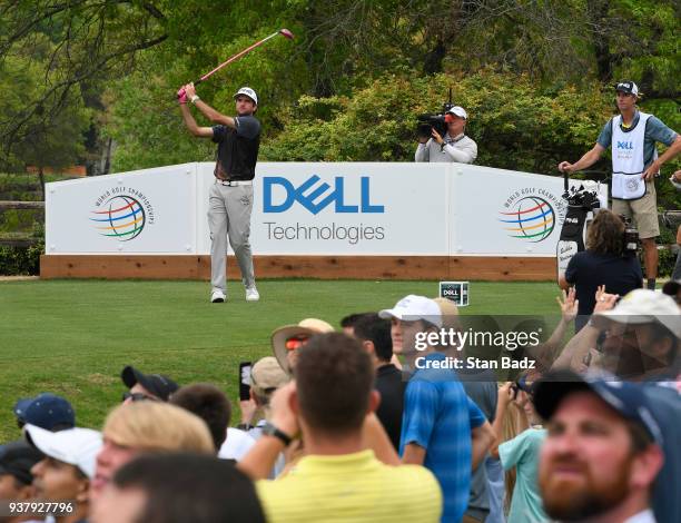 Fans watch Bubba Watson hitting a tee shot on the sixth hole during the championship match at the World Golf Championships-Dell Technologies Match...