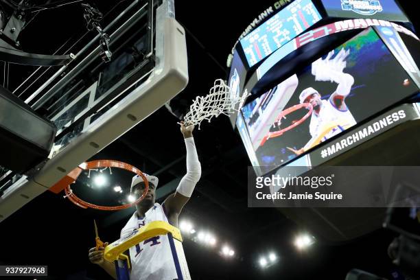 Malik Newman of the Kansas Jayhawks celebrates cutting down the net after defeating the Duke Blue Devils with a score of 81 to 85 in the 2018 NCAA...