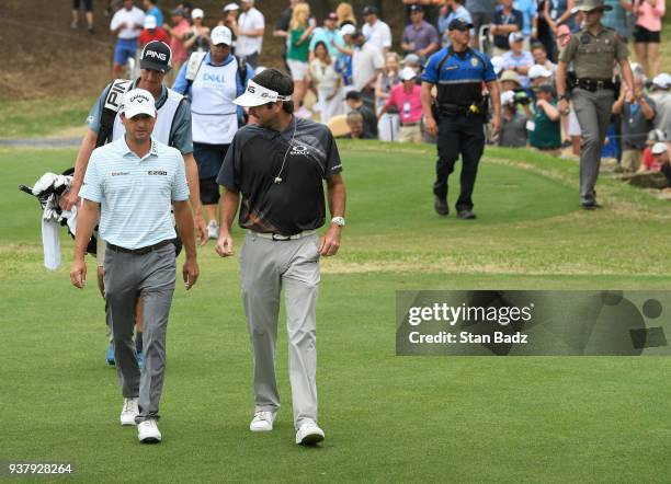 Kevin Kisner and Bubba Watson approach the first tee during the championship match at the World Golf Championships-Dell Technologies Match Play at...