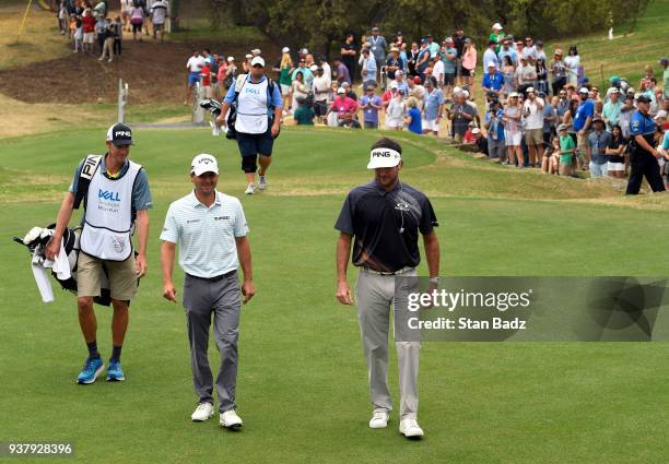 Kevin Kisner and Bubba Watson approach the first tee during the championship match at the World Golf Championships-Dell Technologies Match Play at...