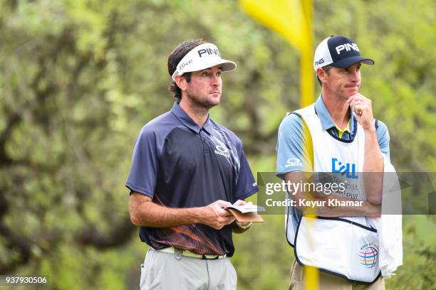 Bubba Watson and his caddie Ted Scott wait to putt on the 10th hole green during the championship match at the World Golf Championships-Dell...