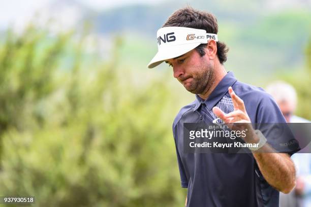 Bubba Watson waves to fans after making a birdie putt on the 10th hole green during the championship match at the World Golf Championships-Dell...