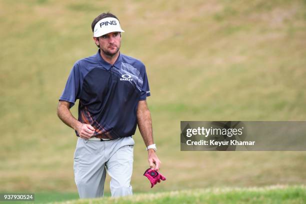 Bubba Watson walks down the 12th hole fairway with his glove in hand during the championship match at the World Golf Championships-Dell Technologies...