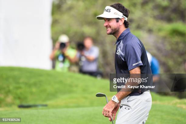 Bubba Watson smiles after his chip shot to the 12th hole green during the championship match at the World Golf Championships-Dell Technologies Match...