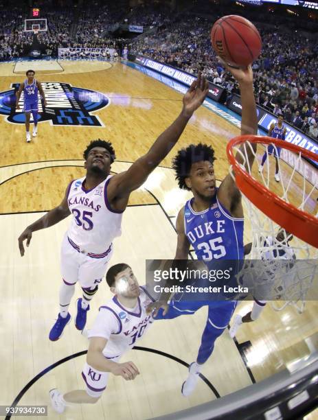 Marvin Bagley III of the Duke Blue Devils attempts a shot defended by Udoka Azubuike of the Kansas Jayhawks in the 2018 NCAA Men's Basketball...