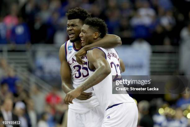 Udoka Azubuike and Silvio De Sousa of the Kansas Jayhawks celebrate after defeating the Duke Blue Devils with a score of 81 to 85 in the 2018 NCAA...