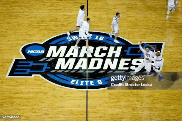 The Kansas Jayhawks celebrate defeating the Duke Blue Devils with a score of 81 to 85 in the 2018 NCAA Men's Basketball Tournament Midwest Regional...