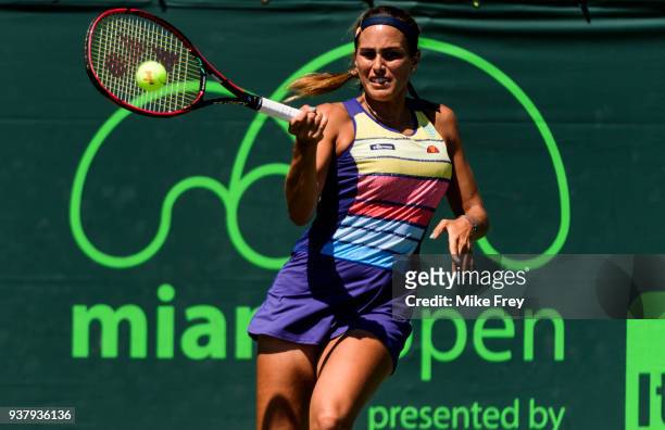Monica Puig of Puerto Rico hits a forehand to Maria Sakkari of Greece during Day 7 of the Miami Open Presented by Itau at Crandon Park Tennis Center...