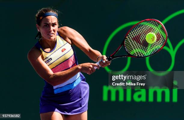 Monica Puig of Puerto Rico hits a backhand to Maria Sakkari of Greece during Day 7 of the Miami Open Presented by Itau at Crandon Park Tennis Center...