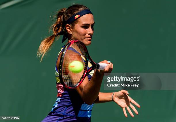 Monica Puig of Puerto Rico hits a forehand to Maria Sakkari of Greece during Day 7 of the Miami Open Presented by Itau at Crandon Park Tennis Center...