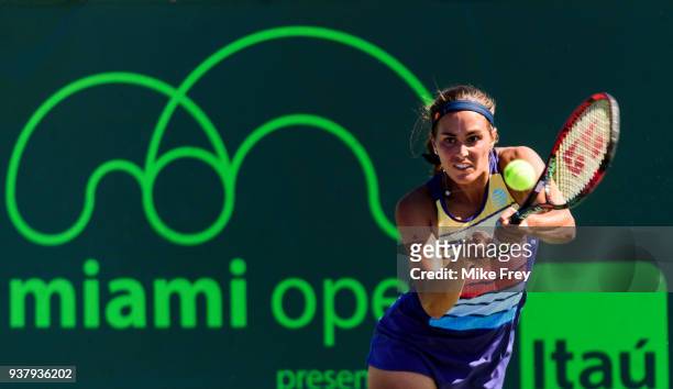 Monica Puig of Puerto Rico hits a backhand to Maria Sakkari of Greece during Day 7 of the Miami Open Presented by Itau at Crandon Park Tennis Center...