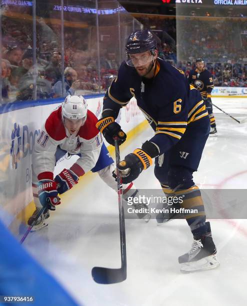 Brendan Gallagher of the Montreal Canadiens and Marco Scandella of the Buffalo Sabres at KeyBank Center on March 23, 2018 in Buffalo, New York....