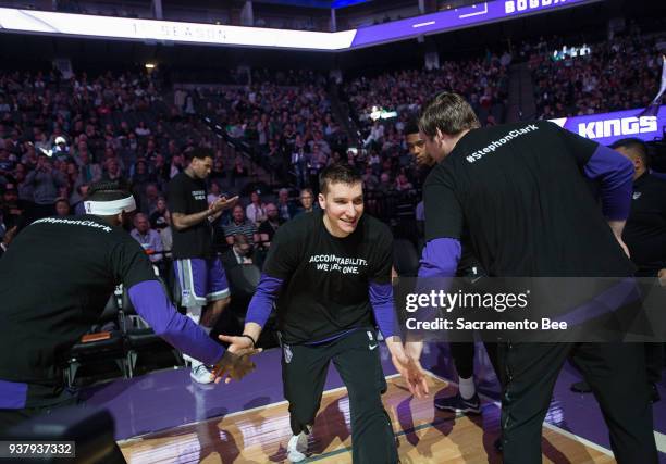 Sacramento Kings guard Bogdan Bogdanovic and teammates wear T-shirts bearing the name of Stephon Clark during a game at Golden 1 Center on Sunday...