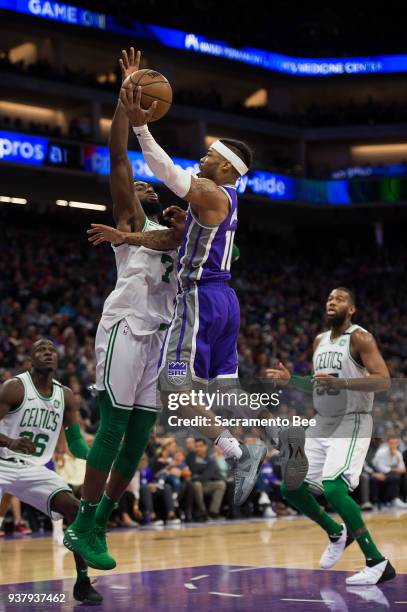 Boston Celtics guard Jaylen Brown defends against a shot by Sacramento Kings guard Frank Mason III in the fourth quarter on Sunday, March 25, 2018 at...