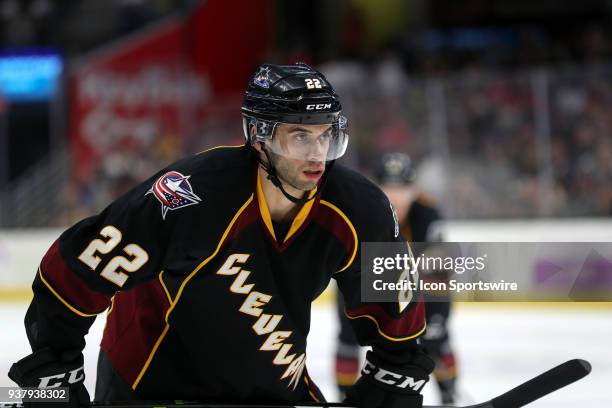 Cleveland Monsters center Joe Pendenza prepares to take a faceoff during the second period of the American Hockey League game between the San Diego...