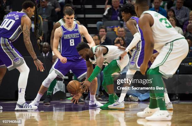 Boston Celtics guard Jaylen Brown battles Sacramento Kings guard Bogdan Bogdanovic for a rebound on Sunday, March 25, 2018 at Golden 1 Center in...