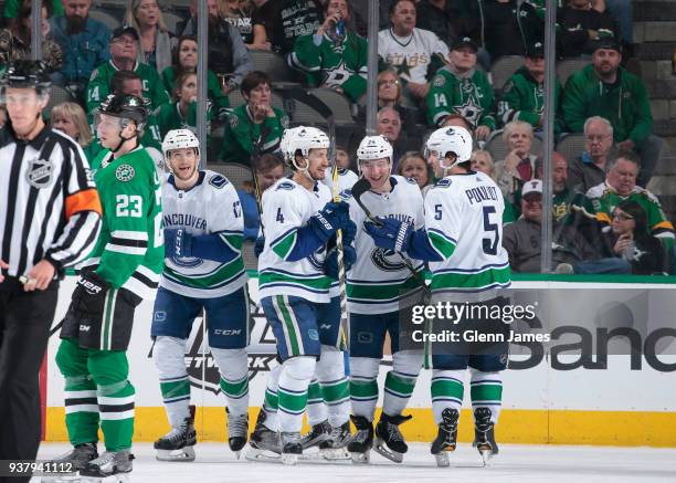 Nic Dowd, Michael Del Zotto, Reid Boucher and Derrick Pouliot of the Vancouver Canucks celebrate a goal against the Dallas Stars at the American...