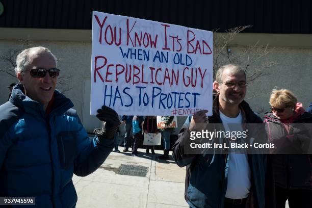 Demonstrator hold up sign "You Know if is Bad when an old Republican Guy Has to Protest" walking down South Street during the March For Our Lives in...