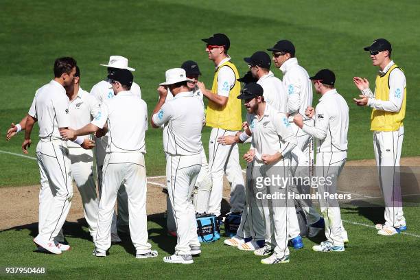 New Zealand celebrate after a sucessful review of the wicket of Moeen Ali of England bowled lbw Trent Boult during day five of the First Test match...