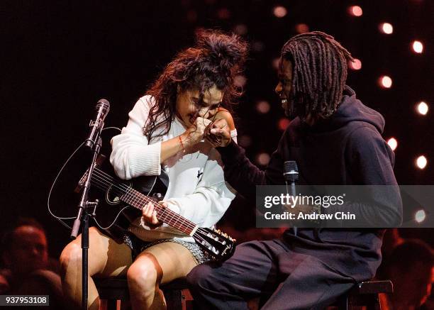 Canadian singer-songwriters Jessie Reyez and Daniel Caesar perform on stage during the 2018 JUNO Awards at Rogers Arena on March 25, 2018 in...