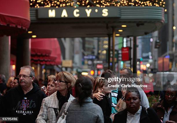 Shoppers and pedestrians stand and walk in front of Macy's December 3, 2009 in New York City. Retail sales declined 0.3 percent, with Macy's dopping...
