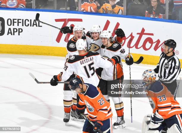 Ryan Getzlaf, Rickard Rakell, Hampus Lindholm, and Josh Manson of the Anaheim Ducks celebrate after winning the game against the Edmonton Oilers on...