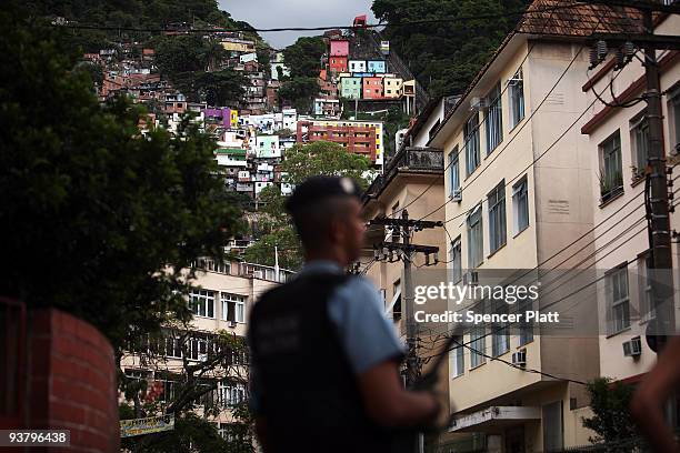 Police officer stands on the edge of recently "pacified" Santa Marta, one of Rio's oldest slums, or favela on December 3, 2009 in Rio de Janeiro,...