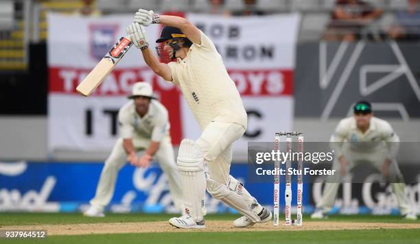 England batsman Chris Woakes drives towards the boundary during day five of the First Test Match between the New Zealand Black Caps and England at...