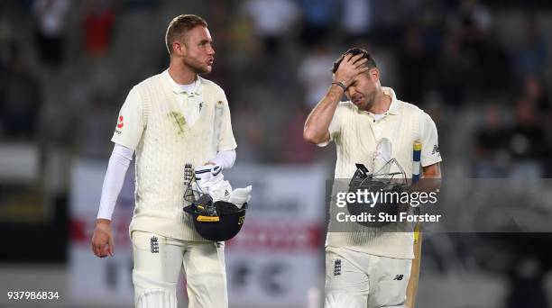 England batsmen Stuart Broad and James Anderson leave the field after Anderson was the last man out and New Zealand win the match during day five of...