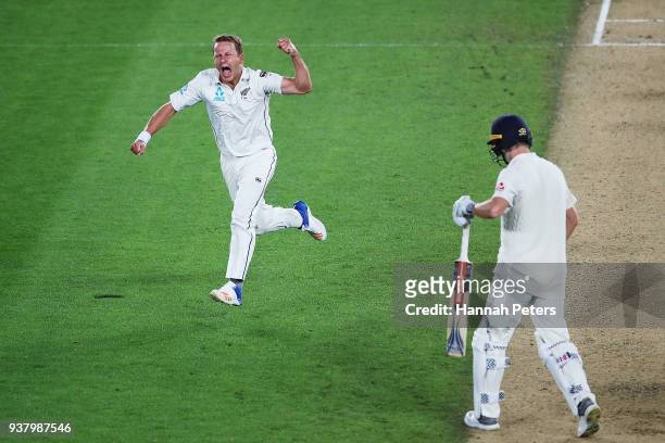 Neil Wagner of the Black Caps celebrates after claiming the wicket of Chris Woakes of England during day five of the First Test match between New...