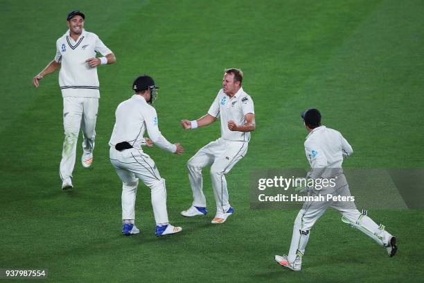 Neil Wagner of the Black Caps celebrates after claiming the wicket of Chris Woakes of England during day five of the First Test match between New...