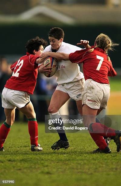 Shelley Rae of England is tackled by the Wales defence during the Womens International between England and Wales at Old Deer Park, Richmond, Surrey....